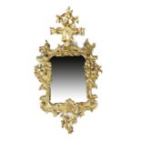 A GILTWOOD ROCOCO WALL MIRROR POSSIBLY GERMAN OR ITALIAN, 18TH CENTURY the shaped plate in a 'C'