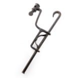 AN IRON HANGING CANDLEHOLDER 19TH CENTURY one end with a hook, with an adjustable sconce and with