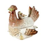 A POTTERY EGG BOX AND COVER 19TH CENTURY in the form of a hen with her chicks 16.6cm high, 18cm