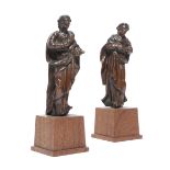 A PAIR OF CARVED WALNUT FIGURES OF SAINTS PROBABLY ITALIAN, 17TH / 18TH CENTURY each raised on a