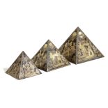 THREE EGYPTIAN GRAND TOUR GILT METAL MODELS OF PYRAMIDS EARLY 20TH CENTURY graduated and decorated