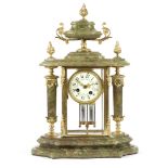 A FRENCH ONYX AND ORMOLU MANTEL CLOCK LATE 19TH / EARLY 20TH CENTURY the brass eight day drum