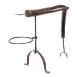 A FOLK ART ELM AND WROUGHT IRON DOWN HEARTH SPIT DOG MID-18TH CENTURY with two prongs above a