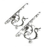 A PAIR OF BLACK PAINTED WROUGHT IRON WALL BRACKETS PROBABLY SOUTH GERMAN, 18TH / 19TH CENTURY with