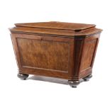 A GEORGE IV MAHOGANY SARCOPHAGUS SHAPE WINE COOLER C.1820 veneered with an unusual cut of timber,