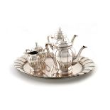 A four-piece German tea and coffee set with a tray, by Lutz and Weiss, Pforzheim circa 1920, lobed
