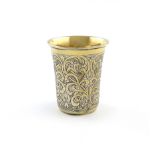 A 19th century Turkish parcel-gilt silver beaker, tapering circular form, engraved gilded foliate