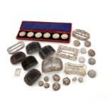 A mixed lot of silver buttons and buckles, comprising: a cased set of six buttons, with import marks