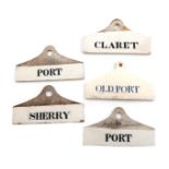 A collection of five 19th century ceramic bin labels, comprising: a creamware one of coat hanger