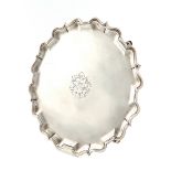 A George II silver salver, by Edward Cornock, London 1731, circular form, moulded border, on four