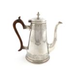 A George III Irish silver coffee pot, by Thomas Williamson, Dublin 1736, tapering circular from,