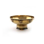 By A. E. Jones, an Arts and Crafts silver-gilt bowl, Birmingham 1930, circular form, spot-hammered