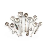 A small collection of Arts and Crafts silver salt spoons, comprising: one by Omar Ramsden, London