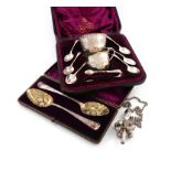A mixed lot of silver items, various dates and makers, comprising: a Victorian cased cream jug and