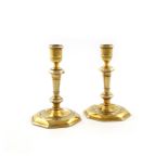 A pair of George II Irish silver-gilt candlesticks, maker's mark possibly I.H, in a rectangular