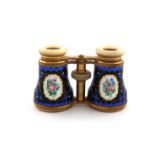 A pair of French gilt metal and enamel opera glasses, marked Verres Superieurs, enamelled with