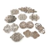 A collection of ten silver nurse's buckles, various dates and makers, including: a Victorian one