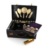 λA silver-gilt travelling dressing table set, by J. Vickery, London 1924, with engine-turned