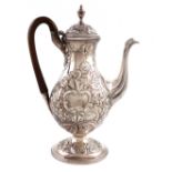 A George III silver coffee pot, main marks lost in decoration, the cover with maker's mark of I.W,