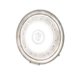 A George III silver salver, by William Bennett, London 1814, circular form, beaded borders, with a