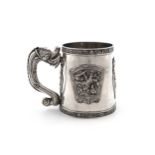 A late-19th century Chinese silver mug, tapering circular form, the scroll handle formed as a