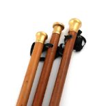 A small collection of late 18th century gold-mounted walking canes, comprising: an English one,