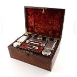 A George IV silver-mounted travelling toilet set, possibly by Thomas Diller, London 1828, retailed