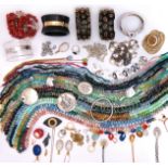 A large quantity of jewellery, including various hardstone bead necklaces, a silver bangle, a silver