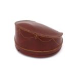 A fitted tiara case, the brown leather with gilt tooled decoration, purple velvet interior with silk