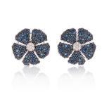 A pair of flowerhead earrings, centred with a diamond cluster and the petals pave-set with