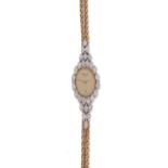 A lady's diamond wristwatch by Chopard, the signed gold dial set within a surround of marquise-