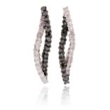 A pair of black and white diamond earrings, formed of interwoven lines of circular-cut black and