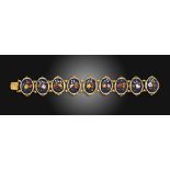 A 19th century pietra dura gold bracelet, mounted with nine oval pietra dura floral mosaic panels,