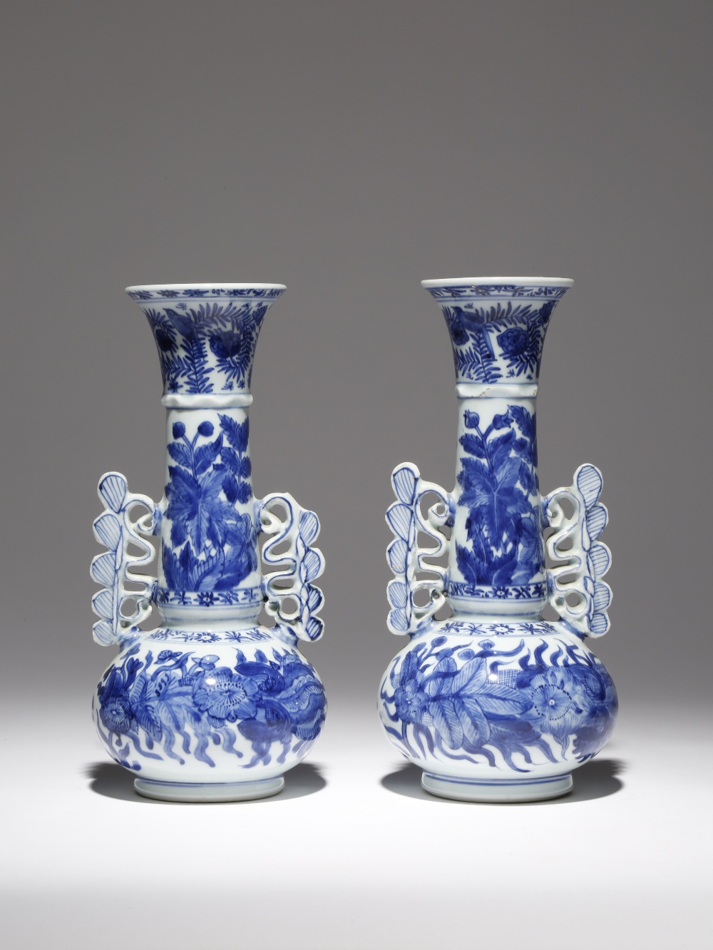 A PAIR OF CHINESE BLUE AND WHITE VENETIAN GLASS STYLE BOTTLE VASES KANGXI 1662-1722 Each with a