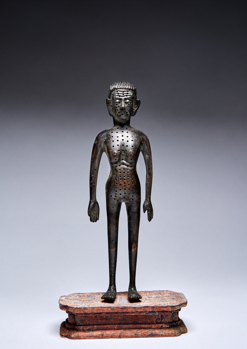 A RARE CHINESE IMPERIAL BRONZE ACUPUNCTURE FIGURE YONGZHENG 1723-35 Depicted standing tall, with a