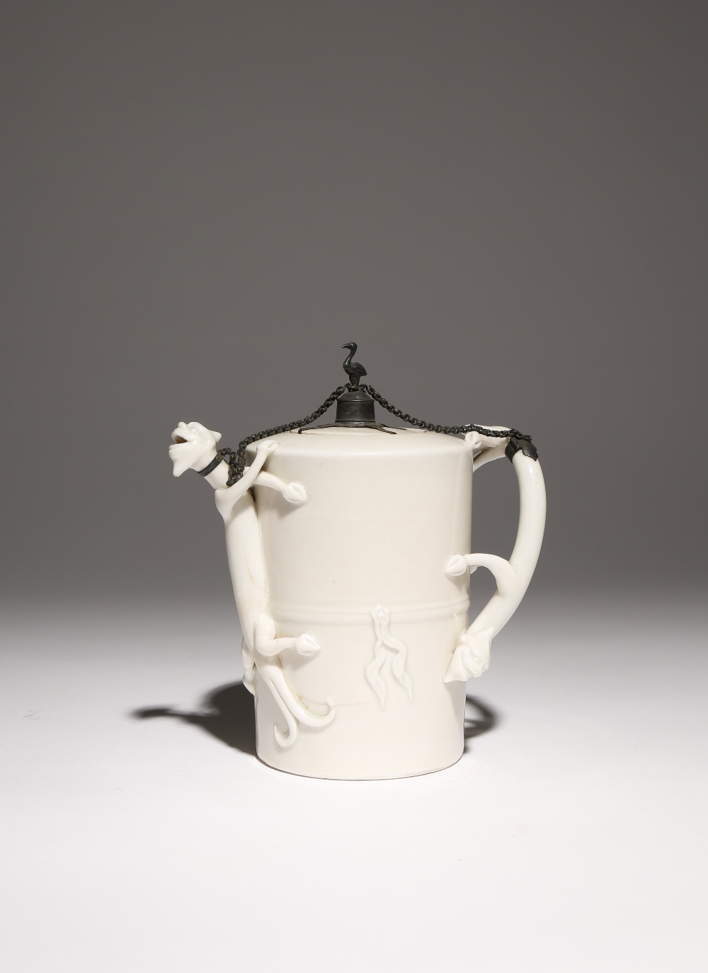 A CHINESE BLANC DE CHINE 'CHILONG' TEAPOT AND COVER KANGXI 1662-1722 Decorated in relief with a