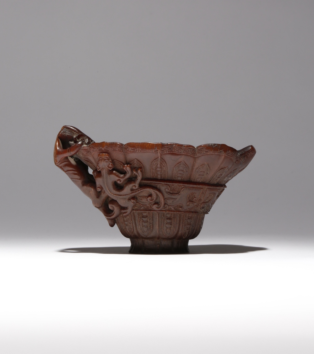 λ A CHINESE ARCHAISTIC RHINOCEROS HORN 'CHILONG' LIBATION CUP 17TH/18TH CENTURY Carved to the - Image 3 of 3