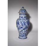 A CHINESE BLUE AND WHITE MOULDED BALUSTER VASE AND COVER KANGXI 1662-1722 Painted with four rows
