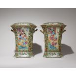 A PAIR OF CHINESE CANTON FAMILLE ROSE BOUGH POTS AND COVERS 19TH CENTURY Brightly decorated with