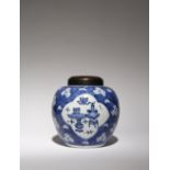 A CHINESE BLUE AND WHITE 'HUNDRED ANTIQUES' VASE KANGXI 1662-1722 Painted with three quatrefoil