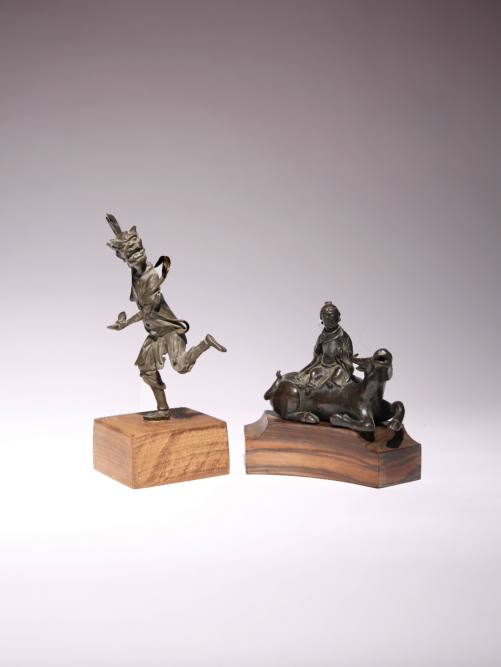 TWO CHINESE BRONZE FIGURES MING DYNASTY One cast as Kui Xing running, holding an ingot in one