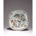 A CHINESE FAMILLE VERTE 'WILLOW' DISH KANGXI 1662-1722 Painted in enamels and gilt with a large