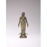 AN INDIAN BRONZE FIGURE OF A DEITY 18TH/19TH CENTURY Cast standing in kayotsarga upon a lotus