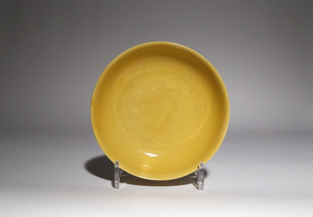 A CHINESE IMPERIAL YELLOW GLAZED 'DRAGON' DISH SIX CHARACTER DAOGUANG MARK AND OF THE PERIOD 1821-50