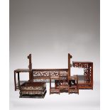 FIVE CHINESE WOOD STANDS 19TH AND 20TH CENTURY Comprising: a large stand for a table screen, a