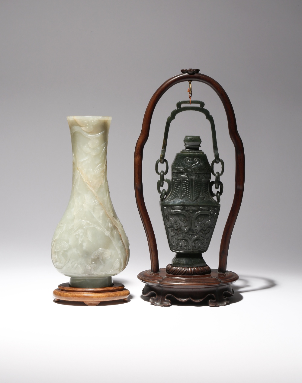A CHINESE CELADON JADE PEAR-SHAPED VASE AND A SPINACH-GREEN JADE VASE AND COVER MING AND QING