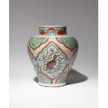 A CHINESE WUCAI 'FISH' BALUSTER VASE 17TH CENTURY Painted with four large cartouches enclosing a