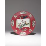 A SAMSON FAMILLE ROSE RUBY-GROUND 'COCKERELS' DISH 19TH CENTURY Painted with a handscroll