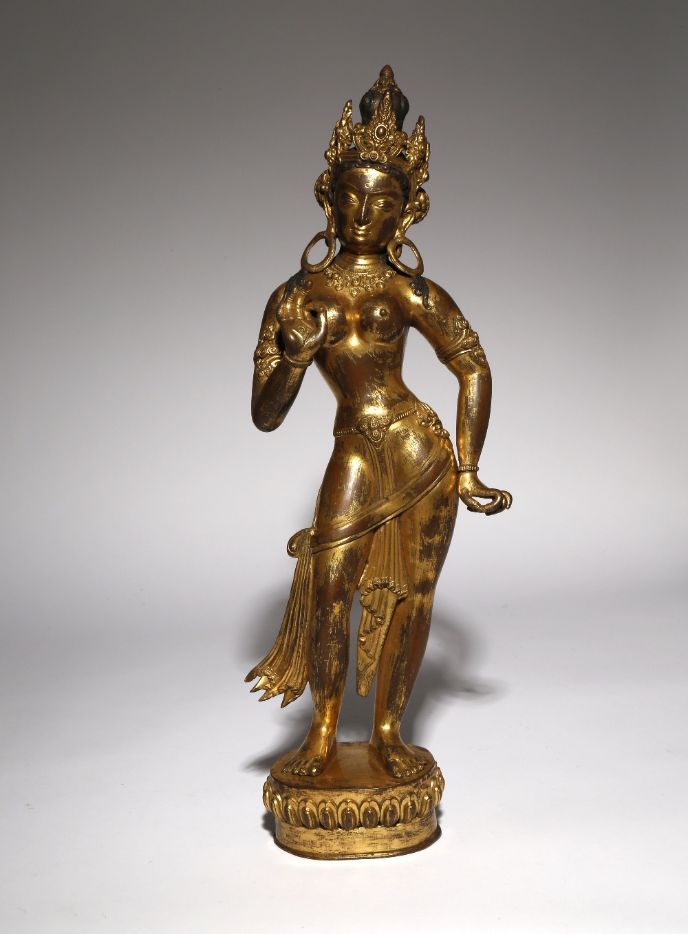 A LARGE TIBETAN GILT-BRONZE FIGURE OF A BODHISATTVA PROBABLY LATE QING DYNASTY Cast standing in