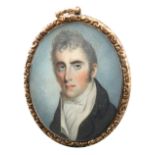 λEnglish School c.1810 Portrait miniature of a gentleman wearing a black coat and cream waistcoat